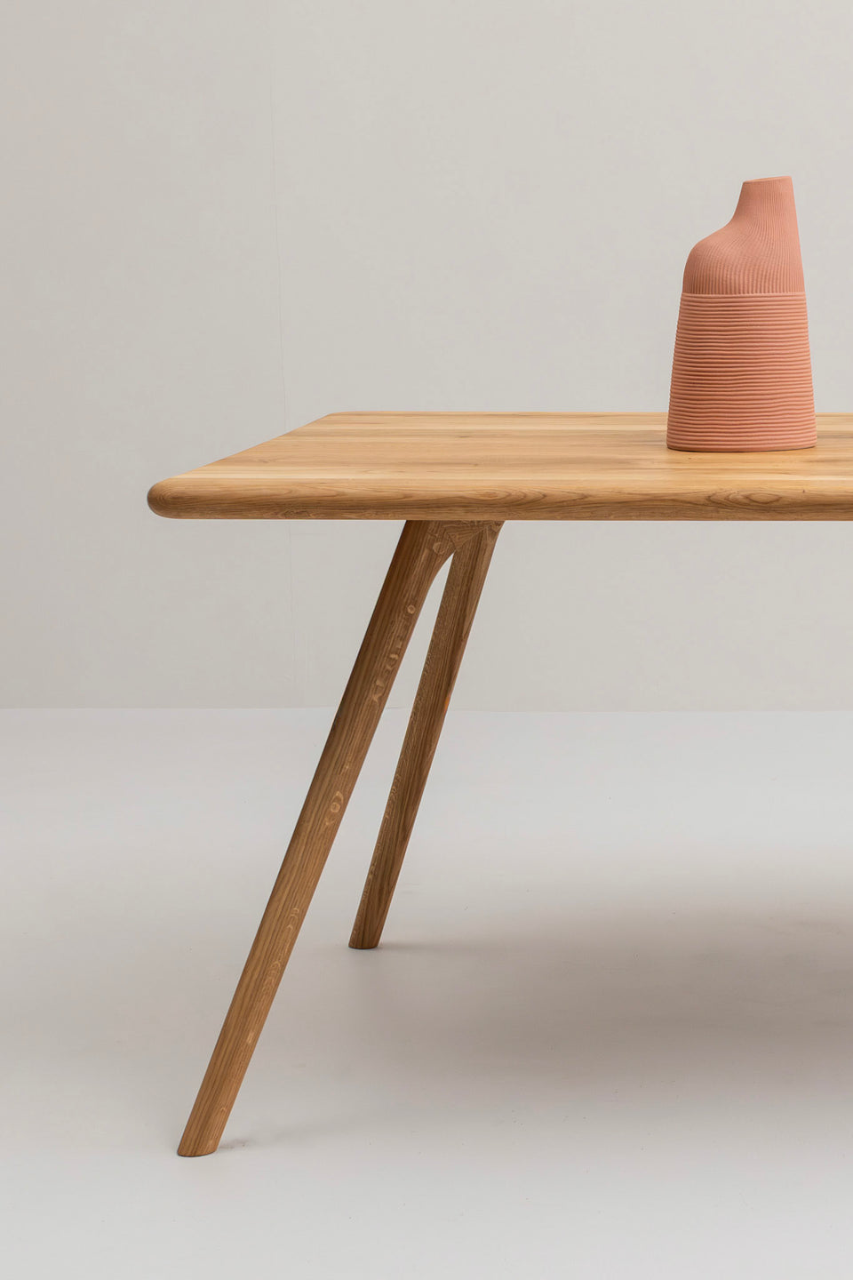 Verfeinerte, rechteckige Silhouette mit sanft abgerundeten Ecken.